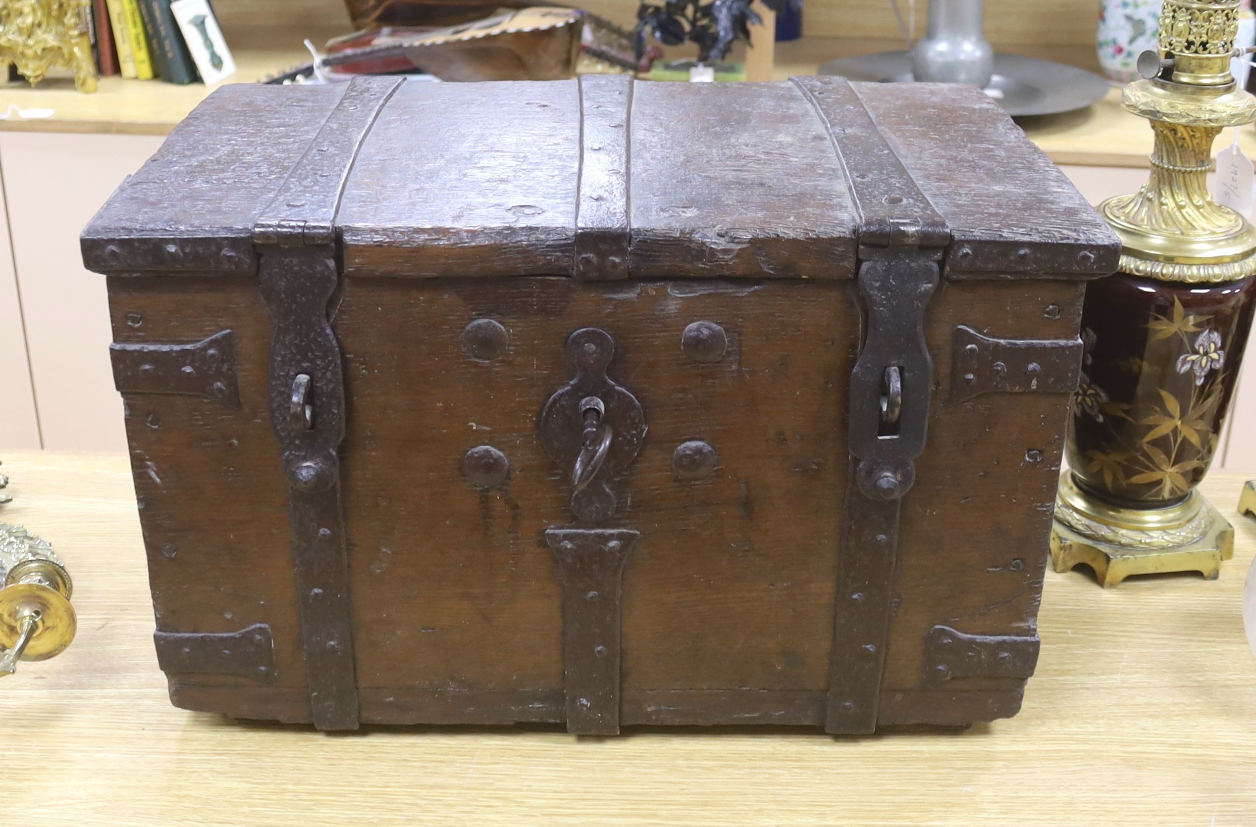 A 17th/18th century iron bound oak strong box, 60cm wide, 36cm deep, 35.5cm high